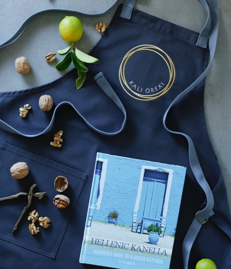 A perfect gourmet gift for foodies & ideal for dads who love to cook! Ruth Bardis' author signed multi-awarded book Hellenic Kanella, Memories Made in a Greek Kitchen, and Kali Orexi's stylish denim "style" apron together will make anyone love cooking. Buy online for delivery anywhere in Australia by Grecian Purveyor